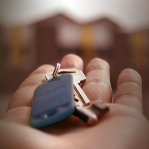 man holding house keys